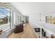 Open concept hallway with hardwood floors and ample natural light at 3631 San Remo Ter, Sarasota, FL 34239
