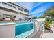 Stunning infinity pool with a glass wall feature at 3631 San Remo Ter, Sarasota, FL 34239