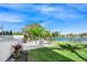 Landscaped backyard with patio and water views at 3631 San Remo Ter, Sarasota, FL 34239