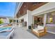 Outdoor kitchen and lounge area with pool access at 3631 San Remo Ter, Sarasota, FL 34239