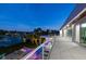 Evening view of rooftop deck with pool and water views at 3631 San Remo Ter, Sarasota, FL 34239
