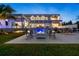 Modern home with fire pit and patio seating at 3631 San Remo Ter, Sarasota, FL 34239