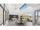 Open living area with water views, featuring a white sectional sofa and wooden coffee table at 3631 San Remo Ter, Sarasota, FL 34239