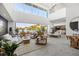 Spacious living area with high ceilings,water views, and modern furniture at 3631 San Remo Ter, Sarasota, FL 34239