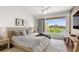 Main bedroom with light wood platform bed and access to balcony at 3631 San Remo Ter, Sarasota, FL 34239
