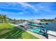 Private boat dock with multiple watercraft and paddle boards at 3631 San Remo Ter, Sarasota, FL 34239