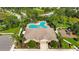 Community pool and clubhouse with lounge chairs and playground nearby at 3636 Summerwind Cir, Bradenton, FL 34209