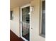 Condo front door entrance with storm door at 3751 S School Ave # 29, Sarasota, FL 34239