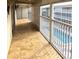 Spacious balcony overlooking the community pool at 3751 S School Ave # 29, Sarasota, FL 34239