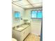 Clean bathroom, granite countertop, and updated vanity at 3751 S School Ave # 29, Sarasota, FL 34239