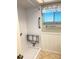 Walk-in shower with a fold-down seat and grab bars at 3751 S School Ave # 29, Sarasota, FL 34239