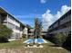 Community courtyard with shuffleboard and benches at 3751 S School Ave # 29, Sarasota, FL 34239