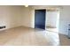 Spacious living room with tile floors and sliding doors to a patio at 3751 S School Ave # 29, Sarasota, FL 34239