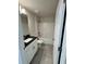 Bathroom featuring a vanity with a dark countertop, tub, and light gray tile floors at 5605 Gaffney Avenue, North Port, FL 34291