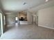 Spacious open floor plan with hard surface floors, modern lighting, and neutral colors throughout at 5605 Gaffney Avenue, North Port, FL 34291