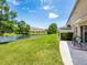 A serene backyard view featuring a pond and manicured landscaping at 6205 Triple Tail Ct # 101, Lakewood Ranch, FL 34202