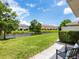 A serene backyard view featuring a pond and manicured landscaping at 6205 Triple Tail Ct # 101, Lakewood Ranch, FL 34202