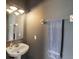 Well-maintained bathroom with pedestal sink, gray walls, and a towel rack at 6205 Triple Tail Ct # 101, Lakewood Ranch, FL 34202