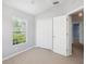 Bedroom with carpet, closet, and a window at 6205 Triple Tail Ct # 101, Lakewood Ranch, FL 34202