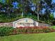 Greenbrook Village community sign with vibrant flowers and landscaping at 6205 Triple Tail Ct # 101, Lakewood Ranch, FL 34202