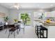 Bright dining area with a contemporary table set and a picturesque view of the waterfront scenery at 6205 Triple Tail Ct # 101, Lakewood Ranch, FL 34202