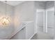 Hallway with carpet, globe light fixture, and white trim at 6205 Triple Tail Ct # 101, Lakewood Ranch, FL 34202