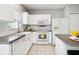 Well-lit kitchen with white cabinets, subway tile backsplash, and stainless steel appliances at 6205 Triple Tail Ct # 101, Lakewood Ranch, FL 34202