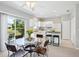 Open-concept kitchen and dining area with white cabinets and views of the water at 6205 Triple Tail Ct # 101, Lakewood Ranch, FL 34202