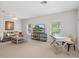 Spacious living room with modern decor, a comfortable couch, and ample natural light through large windows at 6205 Triple Tail Ct # 101, Lakewood Ranch, FL 34202