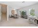 Bright living room featuring neutral tones, a comfortable seating area, and a staircase at 6205 Triple Tail Ct # 101, Lakewood Ranch, FL 34202