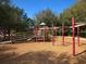 Community playground equipped with modern play structures and safety features for children at 6205 Triple Tail Ct # 101, Lakewood Ranch, FL 34202