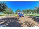 Community playground featuring slides, climbing structures, and open green spaces for play at 6205 Triple Tail Ct # 101, Lakewood Ranch, FL 34202