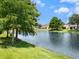 Scenic view of the backyard pond, showcasing a tranquil environment and waterfront property at 6205 Triple Tail Ct # 101, Lakewood Ranch, FL 34202