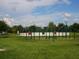 Outdoor racquetball court in a community park with green surroundings and recreational amenities at 6205 Triple Tail Ct # 101, Lakewood Ranch, FL 34202