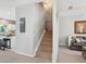 Carpeted stairway to the upper level, with modern lighting at 6205 Triple Tail Ct # 101, Lakewood Ranch, FL 34202