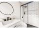 Contemporary bathroom with a stylish sink and shower featuring subway tile and glass door at 6352 Coniston Ter, North Port, FL 34287