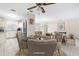 Open-concept dining room showcasing tile flooring and seamless connection to the kitchen and living areas at 6352 Coniston Ter, North Port, FL 34287
