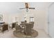 Cozy dining area with seating for four, tile floors, and neutral decor at 6352 Coniston Ter, North Port, FL 34287