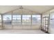 Bright screened porch with view of backyard at 6352 Coniston Ter, North Port, FL 34287