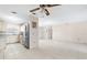 Open living room and kitchen area with tile floors at 6352 Coniston Ter, North Port, FL 34287