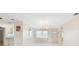 Open-concept living room with tile flooring, natural light, and neutral color palette at 6352 Coniston Ter, North Port, FL 34287