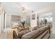 Comfortable living room with tile flooring, neutral furniture, and an open layout at 6352 Coniston Ter, North Port, FL 34287