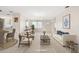 Bright living room boasts tile floors, neutral tones, and comfortable seating arrangements at 6352 Coniston Ter, North Port, FL 34287