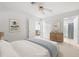 Spacious main bedroom with ensuite bathroom, tile flooring, and double closets at 6352 Coniston Ter, North Port, FL 34287