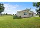 House with a large green lawn and stucco exterior at 6352 Coniston Ter, North Port, FL 34287