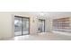 Living area with sliding doors to screened porch at 6352 Coniston Ter, North Port, FL 34287