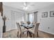 Dining room with glass table and neutral chairs at 6581 Approach Rd # 63, Sarasota, FL 34238