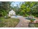 Inviting pool area with a pool house and patio seating at 75 Osprey Point Dr, Osprey, FL 34229