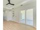 Light and airy bedroom with sliding glass doors leading to patio at 7648 Totem Ave, North Port, FL 34291