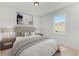 Bright bedroom with a queen-size bed and window at 7648 Totem Ave, North Port, FL 34291